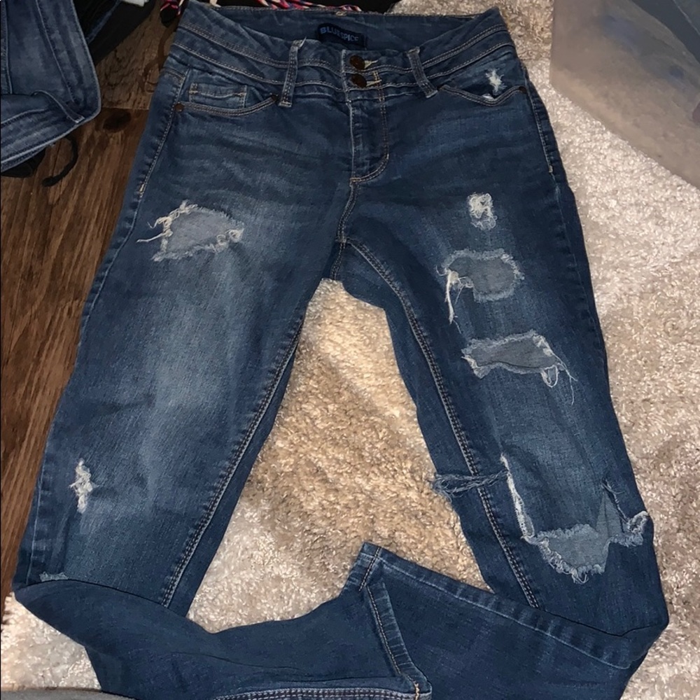 Distressed blue jeans